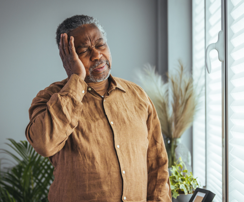 Older man experiencing Migraine pain